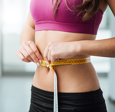 Woman Measuring Waist Woman Measuring Waist